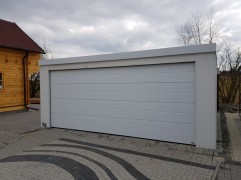 Assembled double garage with plaster and flat roof