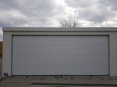 Assembled double garage with plaster and flat roof