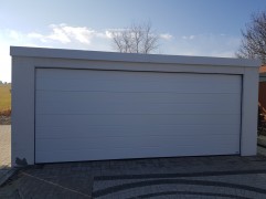 Assembled double garage with plaster and flat roof