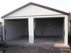 Assembled garage with a shelter and a saddle roof