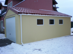 Assembled garage with plaster and saddle roof