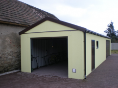 Assembled garage with plaster and saddle roof